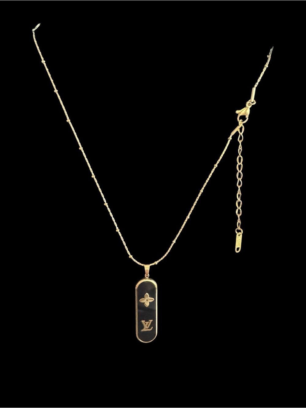 Gold-Tone Black Pendant Necklace with Monogram Motif